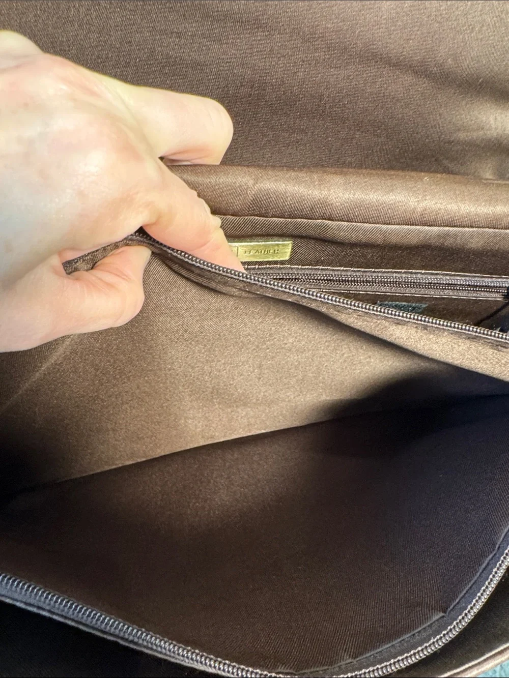 Wilson’s Leather chocolate brown messenger bag with webbed adjustable strap.
